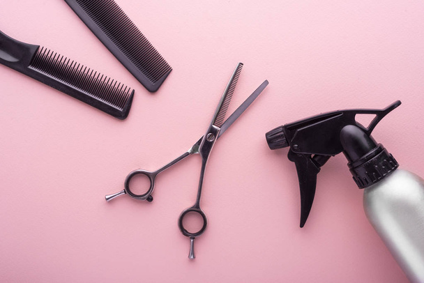 Hairdresser set with various accessories on pink background - Photo, Image