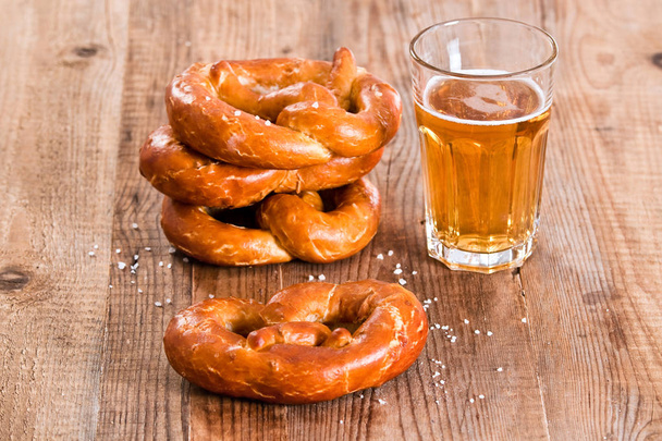 Bavarian pretzels on wooden table.  - Foto, Bild