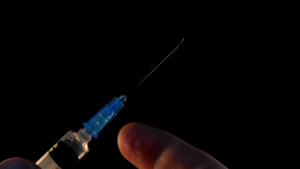 Doctor Flicks On Syringe With Injection To Collect And Release Air Bulbs - Materiaali, video