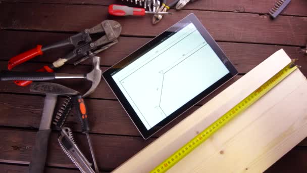 Mechanic engineer works with tablet on his desk - Felvétel, videó
