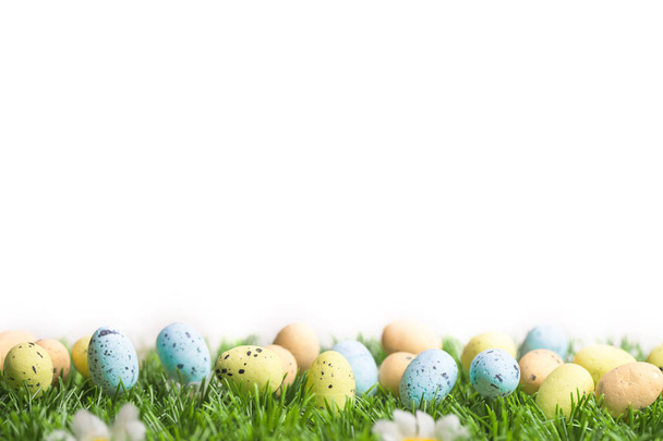 Bunch of easter eggs in pastel colors on grass - Foto, imagen
