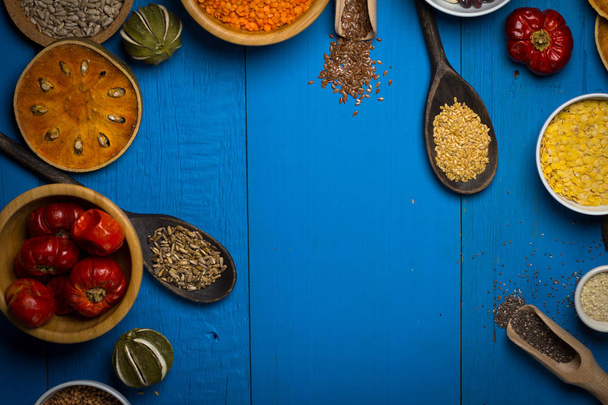 Various Colorful Spices and herbs over rustic wooden background - Photo, Image