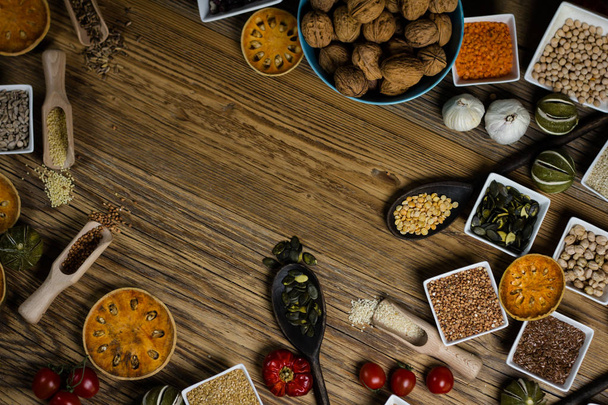 Various Colorful Spices and herbs over rustic wooden background. place for logo - Photo, Image
