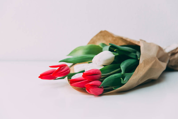  Beautiful bouquet of  tulips in paper bag - 写真・画像