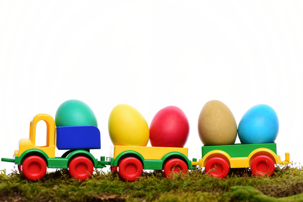painted easter colorful eggs in plastic car toy - Photo, Image