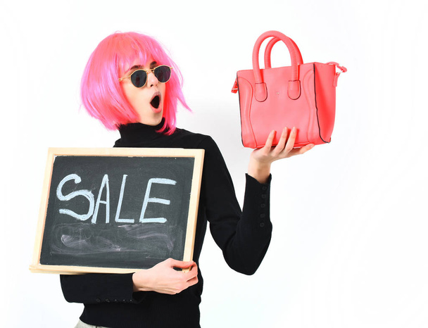 girl in wig holding bag and board with sale inscription - Foto, Imagem