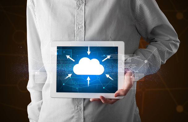 Businessman holding tablet with cloud icon - Photo, Image