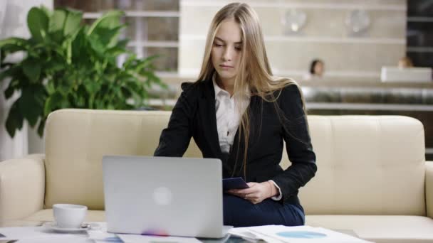 businesswoman working with laptop and documents - Footage, Video