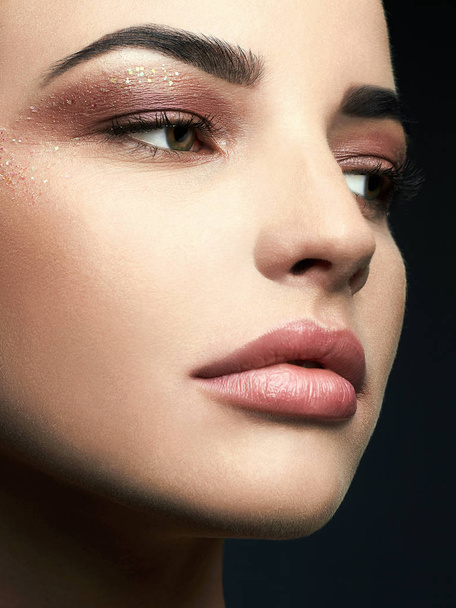 Beauty Make-up with glitter eye shadows - 写真・画像