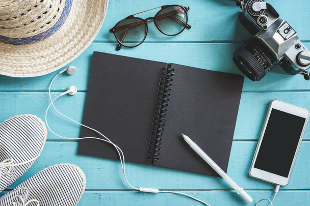 Traveler's accessories, cellphone and notebook with copy space - Foto, Imagen