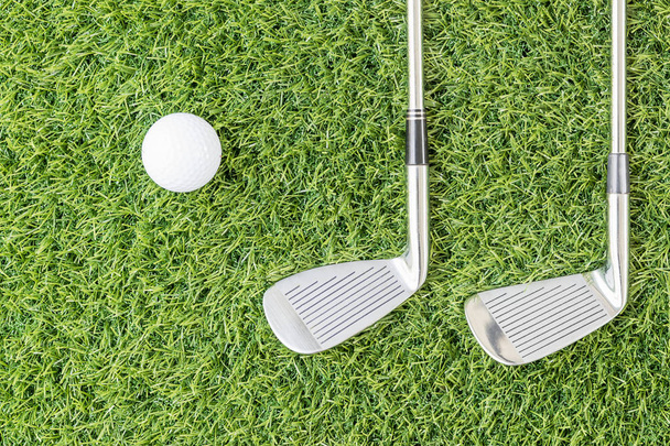 Golf club and Golf ball on green grass - Фото, зображення