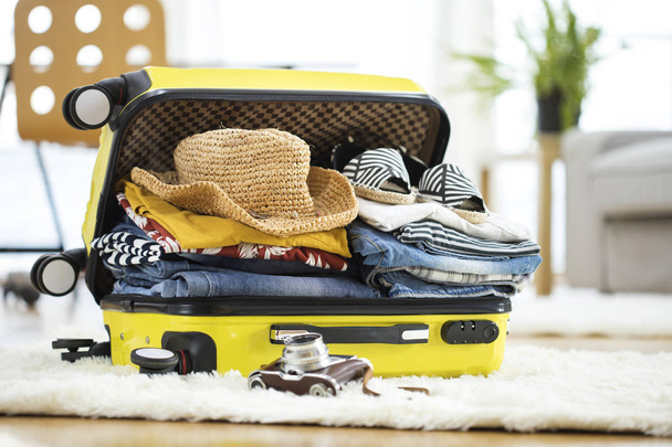 Preparation travel suitcase at home - Foto, imagen