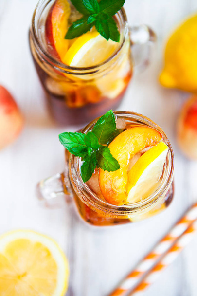 Homemade lemonade with ripe  peaches and fresh mint. Fresh peach - Фото, зображення