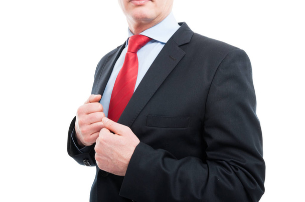 Close-up of senior business man holding jacket - Фото, зображення