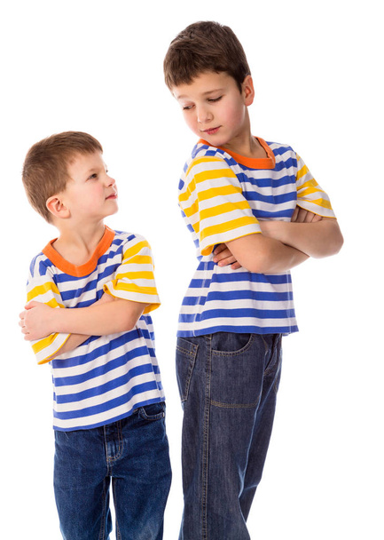 Two conflicting boys standing together on white background - Photo, Image