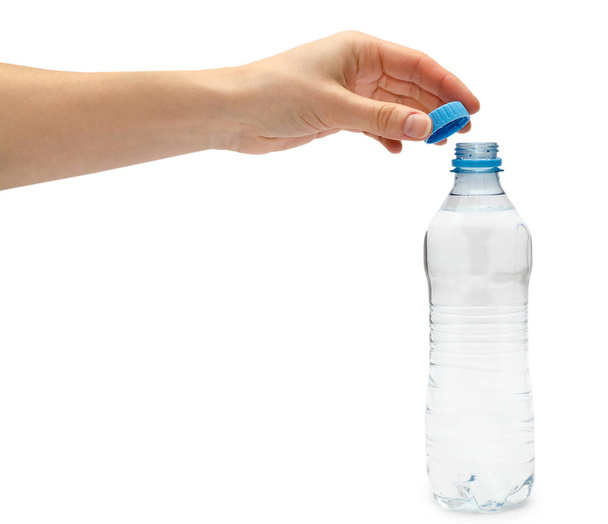 hand of young girl holding water bottle - Foto, Imagem