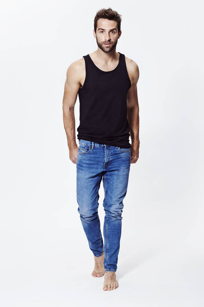 Barefoot handsome man in jeans - Photo, image