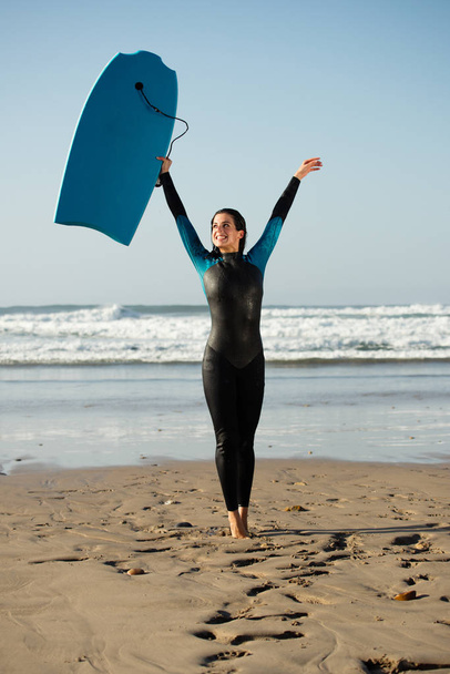 Surfer woman having fun with bodyboard at the beach - Foto, Imagem