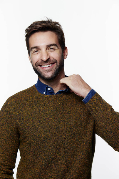 Laughing guy in sweater - Фото, изображение
