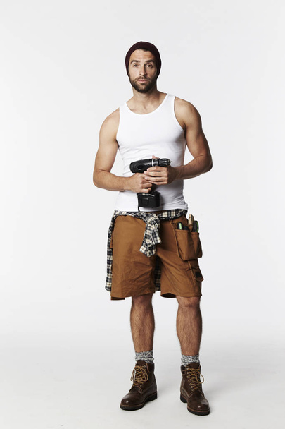 Worker holding dril - Фото, изображение