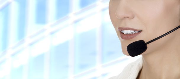Call center woman with headset against abstract background - Photo, image