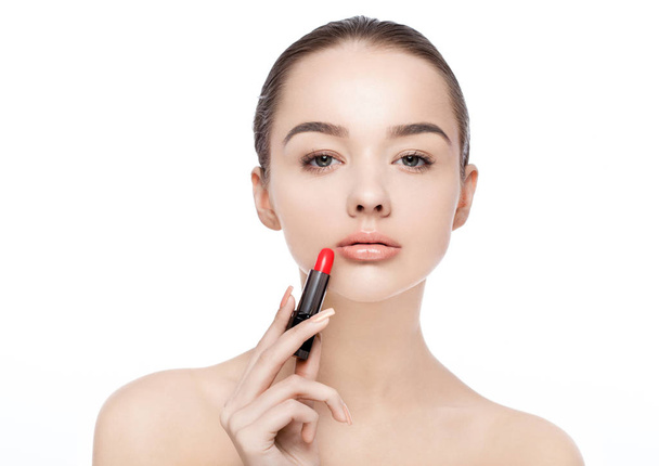 Beautiful model girl holding lipstick tube makeup - Zdjęcie, obraz