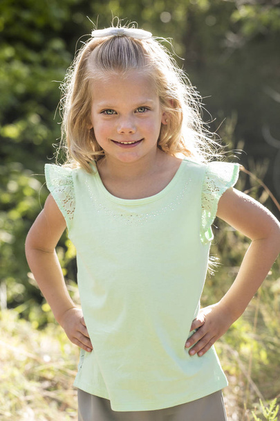 Beautiful Portrait of smiling little girl outdoors - Photo, Image