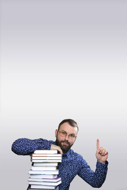 student adult beard man with stack of book - Photo, Image