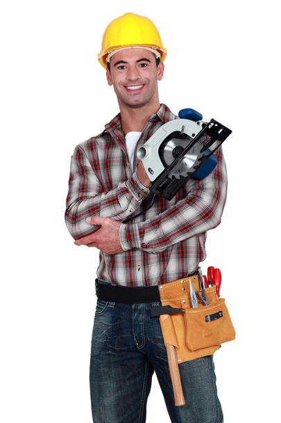 Man holding a circular saw - Zdjęcie, obraz