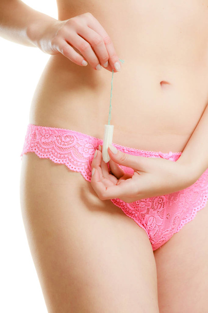 Mentruation time. Girl with hygienic tampon. - Photo, image