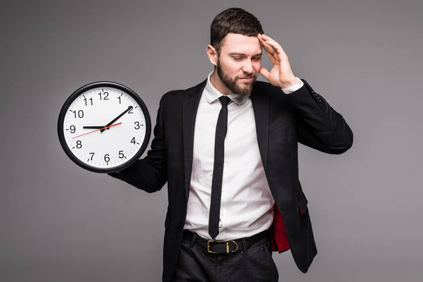 Handsome business man with clock in hand, sad beasy with time, - Fotoğraf, Görsel