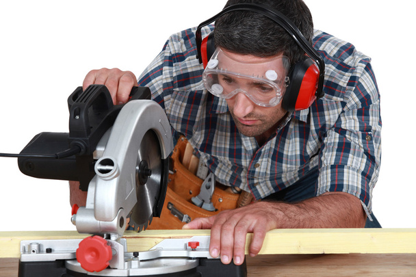 Carpenter cutting wood - Zdjęcie, obraz