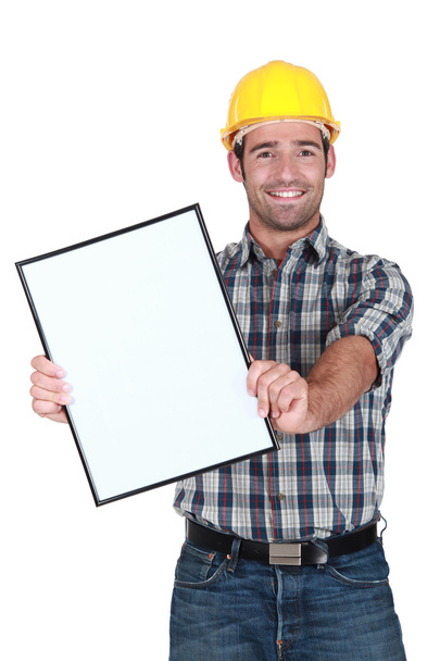 Builder displaying blank advert - Foto, imagen