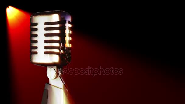 micrófono vocal clásico girando en luces de escenario
 - Imágenes, Vídeo