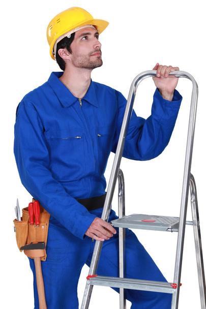Manual worker with a stepladder - Zdjęcie, obraz