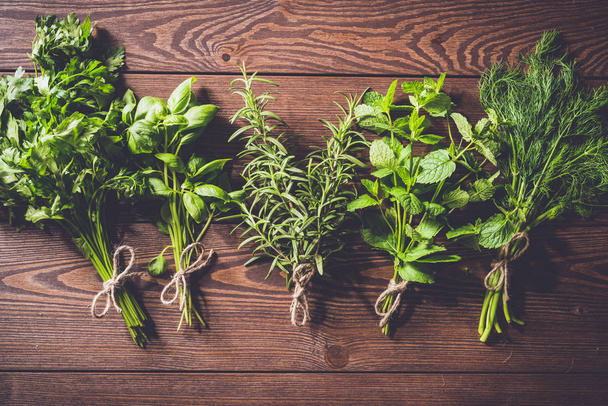 Fresh herbs on an old wooden table - Foto, imagen