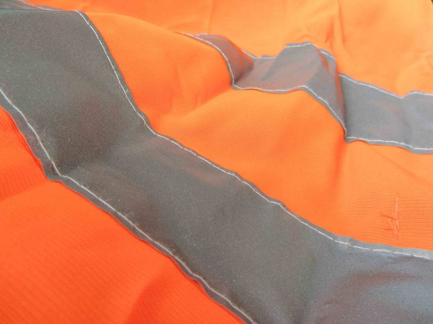 chaqueta naranja de alta visibilidad como fondo
 - Foto, Imagen