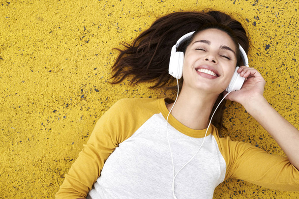 Young woman in headphones   - Фото, изображение