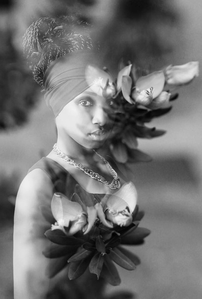 Monochrome double exposure of pretty african girl and flowers - Photo, image