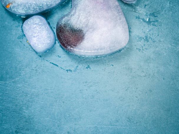 Heart shaped ice cubes with frozen cherry - 写真・画像