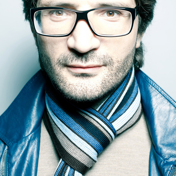 Portrait of a fashionable handsome man in blue jacket with strip - Fotografie, Obrázek