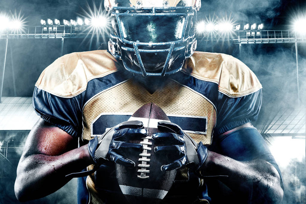 American football sportsman player on stadium with lights on background - Фото, зображення