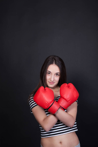 Woman boxer on black background - Zdjęcie, obraz