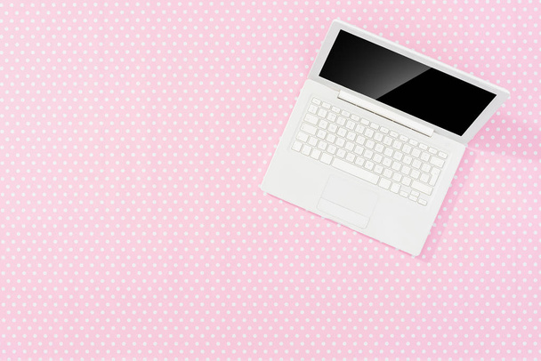 Pink office desktop with white laptop. - Fotoğraf, Görsel