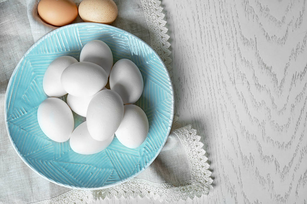 Plate with raw eggs - Φωτογραφία, εικόνα