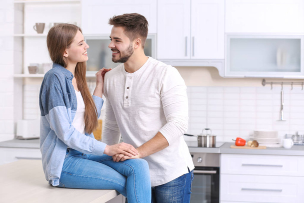 young couple in kitchen  - Foto, Bild