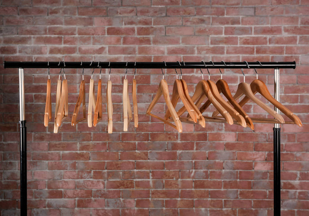 Clothes rail with wooden hangers - Fotoğraf, Görsel