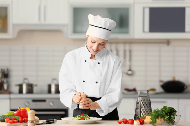 Female chef in kitchen - Фото, изображение