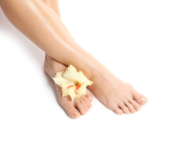 Female legs with flower - Foto, imagen