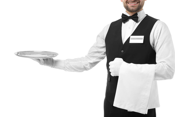 Handsome waiter with metal tray   - Фото, изображение